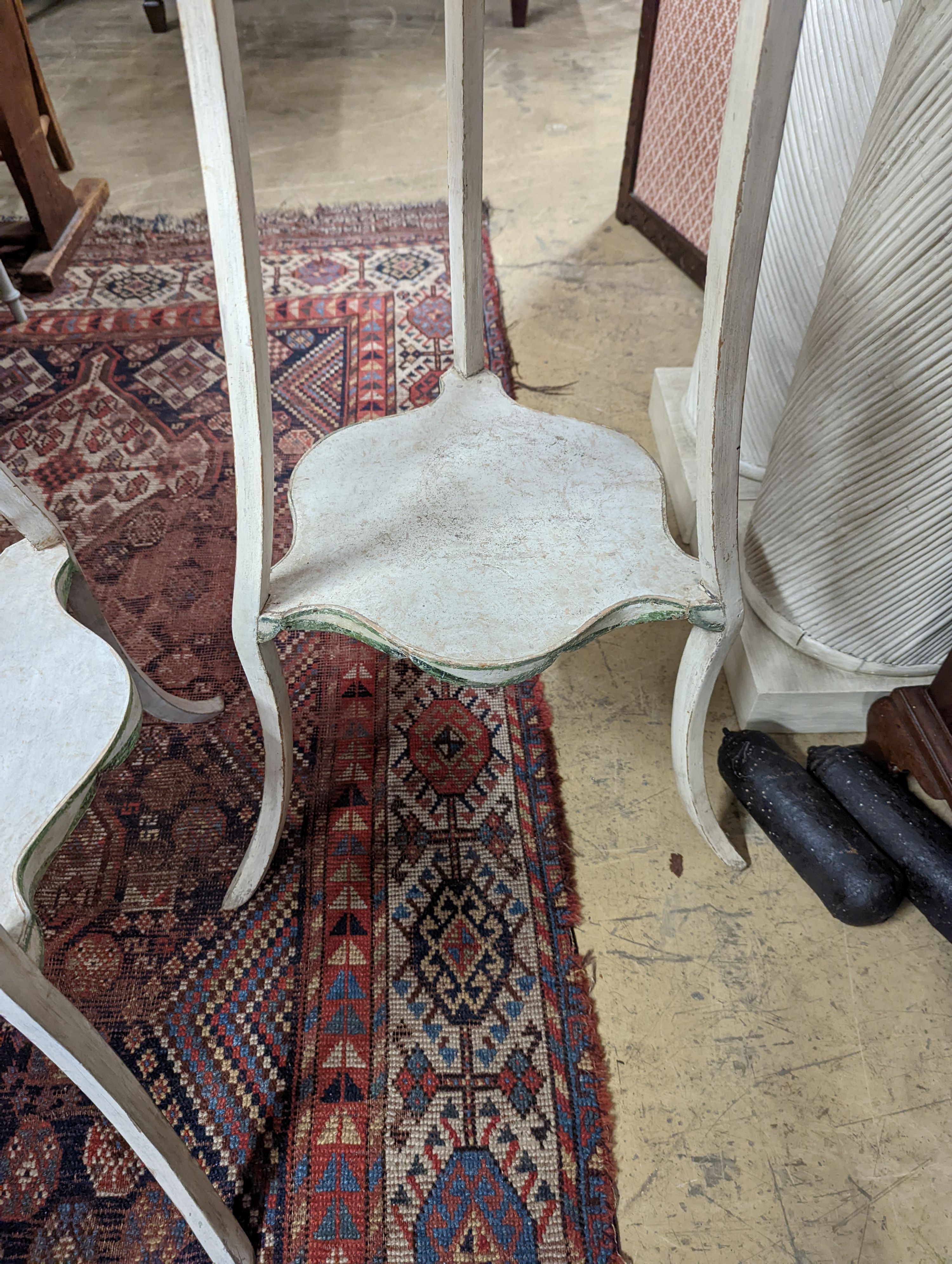 A pair of two-tier white painted plant stands, Colefax & Fowler, height 131cm